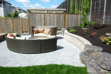 Patio - mid-sized backyard brick patio idea in Toronto
