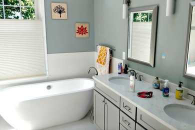 Inspiration for a mid-sized transitional master white tile and porcelain tile porcelain tile and white floor freestanding bathtub remodel in DC Metro with shaker cabinets, gray cabinets, gray walls, an undermount sink and marble countertops
