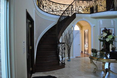 Inspiration for a traditional foyer in New York with beige walls and travertine floors.