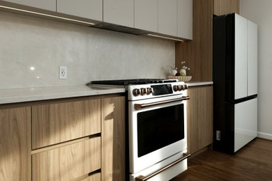 Mid-sized minimalist l-shaped light wood floor and beige floor eat-in kitchen photo in DC Metro with an undermount sink, flat-panel cabinets, light wood cabinets, quartz countertops, beige backsplash, quartz backsplash, white appliances, an island and beige countertops