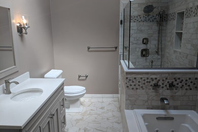 Design ideas for a mid-sized transitional master bathroom in Philadelphia with shaker cabinets, beige cabinets, a drop-in tub, an open shower, a two-piece toilet, white tile, porcelain tile, beige walls, porcelain floors, an undermount sink, engineered quartz benchtops, white floor, a hinged shower door and white benchtops.