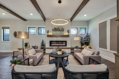 Example of an arts and crafts open concept medium tone wood floor and exposed beam living room design in Columbus