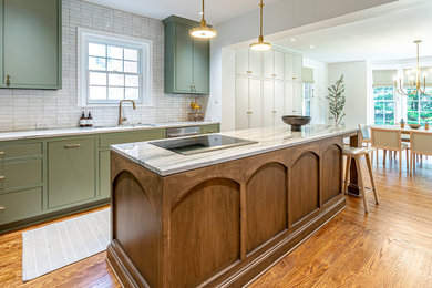 Inspiration for a large 1950s galley light wood floor eat-in kitchen remodel in Richmond with an undermount sink, green cabinets, marble countertops, white backsplash, porcelain backsplash, colored appliances, an island and white countertops
