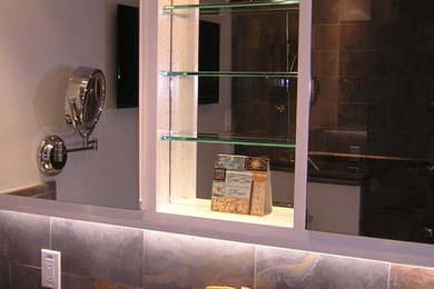 Walk-in shower - mid-sized traditional master multicolored tile and stone tile mosaic tile floor walk-in shower idea in San Francisco with shaker cabinets, white cabinets, a two-piece toilet, green walls, an undermount sink and quartz countertops