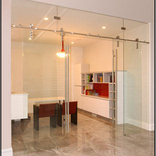 Inspiration for a large modern study in Edmonton with white walls.