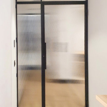Steel door with side and upper panel, textured glass