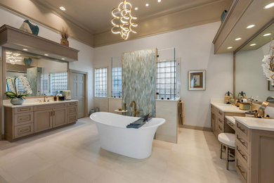 Large contemporary ensuite bathroom in Miami with recessed-panel cabinets, beige cabinets, a freestanding bath, an alcove shower, a two-piece toilet, beige tiles, porcelain tiles, beige walls, porcelain flooring, a submerged sink, engineered stone worktops, beige floors, a hinged door, beige worktops, a shower bench, double sinks and a built in vanity unit.