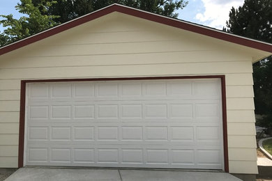 Example of a mid-sized classic detached two-car garage design in Denver