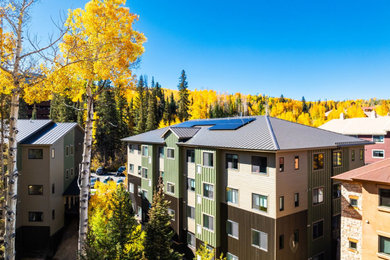 Inspiration for a huge three-story apartment exterior remodel in Denver