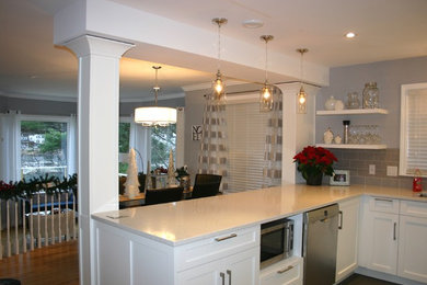 Inspiration for a contemporary u-shaped ceramic tile eat-in kitchen remodel in Other with an undermount sink, shaker cabinets, white cabinets, quartz countertops, gray backsplash, subway tile backsplash and stainless steel appliances