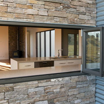 Woodland Grey Aluminium Bi fold Windows above a kitchen bench