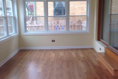 Example of a mid-sized classic medium tone wood floor sunroom design in Chicago with a standard ceiling