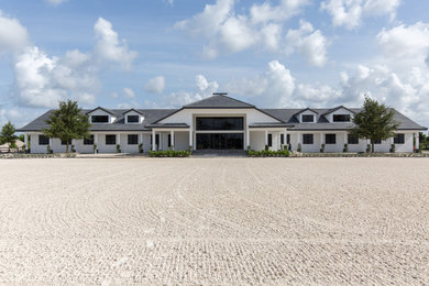 Example of an urban white exterior home design in Miami