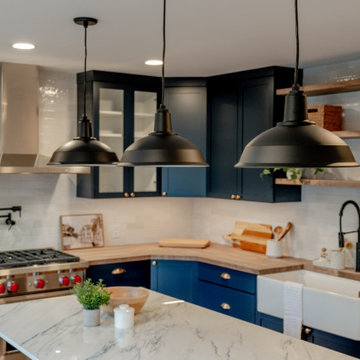 Industrial Matte Black Pendant Lighting over Navy Kitchen Island