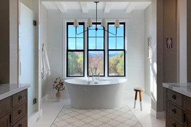 Bathroom - large farmhouse master white tile porcelain tile bathroom idea in Santa Barbara with a one-piece toilet, an undermount sink, quartz countertops, a hinged shower door and a freestanding vanity