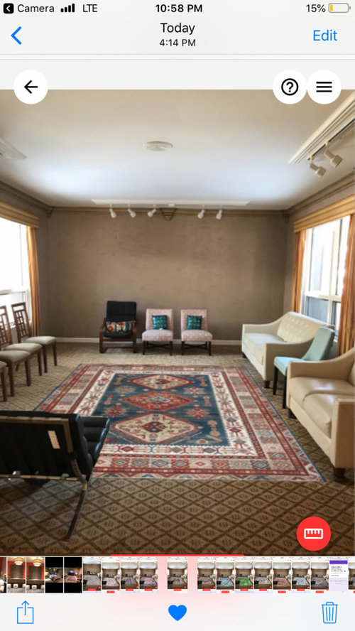 Area Rug Over Wall To Wsll Carpet In Living Room