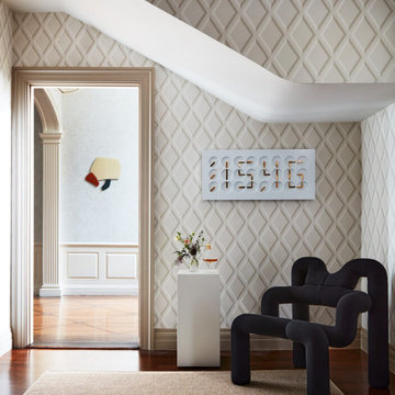 Hallway with Geometric Wallpaper and Sculptural Chair