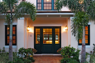 Tuscan two-story exterior home photo in Miami