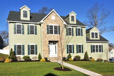 Mid-sized elegant white three-story mixed siding exterior home photo in DC Metro with a shingle roof