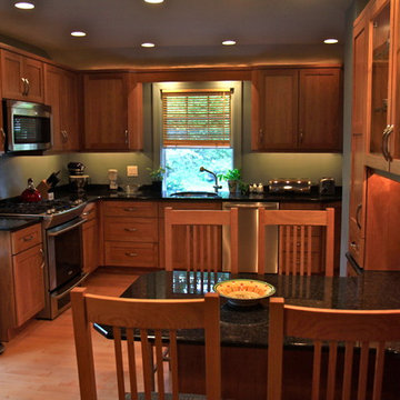 Cohesive Transitional Kitchen | Cherry Cabinets & Black Granite Table