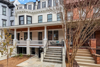 Example of a trendy white three-story townhouse exterior design in DC Metro