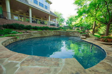 Large transitional backyard custom-shaped and stone natural pool fountain photo in Oklahoma City