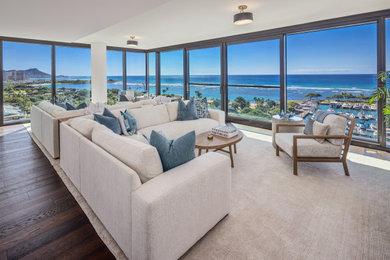 Large beach style open concept dark wood floor and wall paneling living room photo in Hawaii with white walls