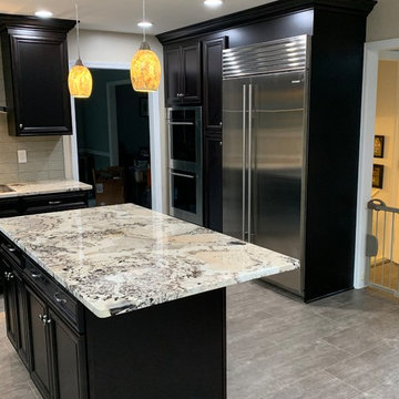kitchen remodel----espresso with granite and glass splash new flooring