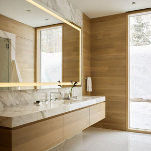 Inspiration for a modern master bathroom in Other with flat-panel cabinets, a single vanity, a floating vanity and wood walls.