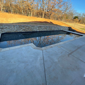 Custom pool with elevated back wall and LED Waterfalls