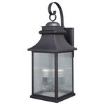 Vaxcel - Cambridge 10" Outdoor Wall Light Oil Rubbed Bronze - The Cambridge collection is the perfect blend of traditional and upscale class. Its updated lantern lines are highlighted in oil rubbed bronze and wrinkle glass panes. Ideal for your porch, entryway, garage, or any other area of your home. Dusk to dawn photo cell automatically turns fixture on in the dark and off in the light for added safety and security, saving energy during daylight hours.
