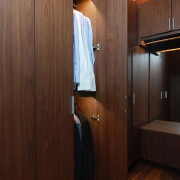 Hidden feline passageway in a luxury his-and-hers master closet