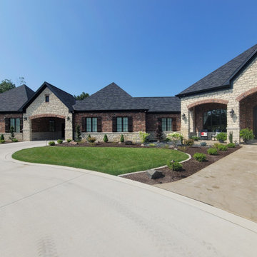 Estate Poolside Landscape & Hardscape Retreat with Custom Waterfeature