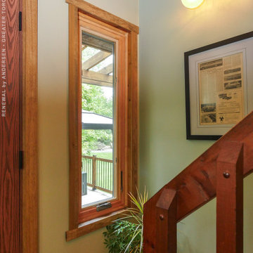 Rich Wood Staircase with New Wood Window - Renewal by Andersen Greater Toronto