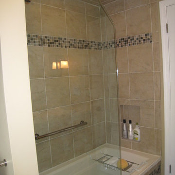3/4 Frameless Tub Shower Door with Dark Cabinets