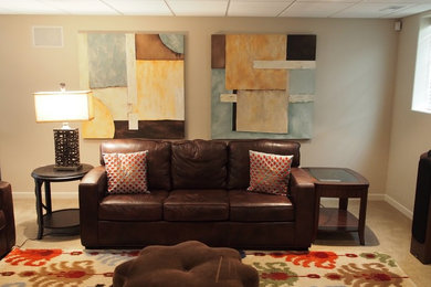 Example of a mid-sized trendy underground carpeted basement design in Other with beige walls