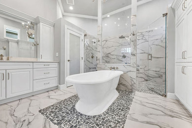 Inspiration for a large contemporary master black and white tile and marble tile marble floor, multicolored floor and double-sink bathroom remodel in Miami with raised-panel cabinets, white cabinets, a two-piece toilet, gray walls, an undermount sink, granite countertops, a hinged shower door, white countertops and a built-in vanity