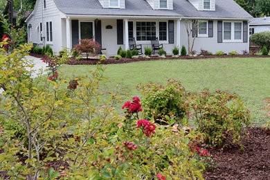 Photo of a mid-sized full sun front yard concrete paver landscaping in DC Metro for spring.