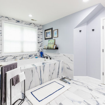Bathroom remodeling in Columbia, MD with double vanity & marble bathtub