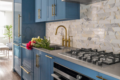 Example of a transitional kitchen design in New York
