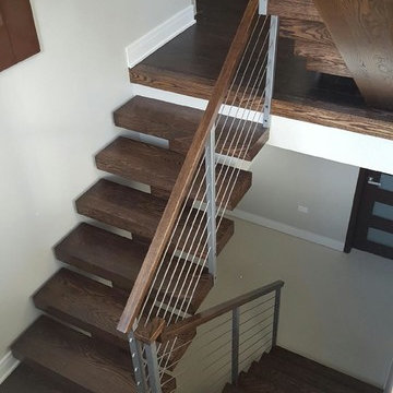 Open riser stairs with stainless steel cable wire railing