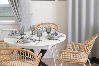 Imagen de comedor escandinavo grande con paredes blancas, suelo de baldosas de porcelana y ladrillo