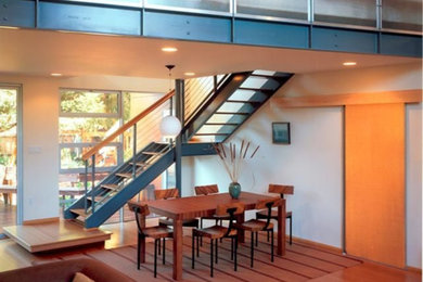 Inspiration for a mid-sized modern medium tone wood floor and brown floor great room remodel in San Francisco with no fireplace