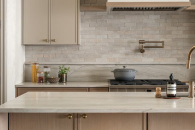 Mid-sized minimalist single-wall eat-in kitchen photo in Austin with shaker cabinets, light wood cabinets, quartzite countertops, white backsplash, terra-cotta backsplash and white countertops