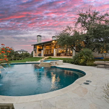 Freeform Pool with Spa and Scuppers in Texas Hill Country