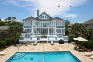 This is an example of a large beach style home design in Atlanta.