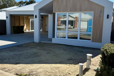 Design ideas for a mid-sized contemporary home design in Perth.