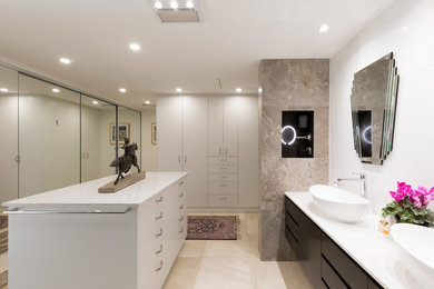 Design ideas for a large modern bathroom in Canberra - Queanbeyan with raised-panel cabinets, brown cabinets, beige tile, ceramic tile, white walls, ceramic floors, a vessel sink, marble benchtops and beige floor.