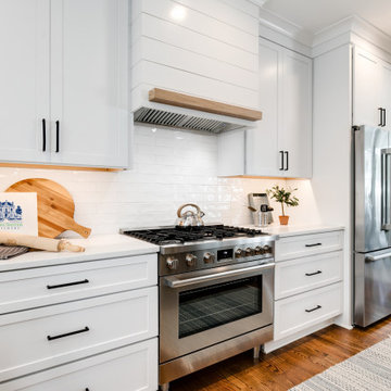 Bright Transitional Kitchen with Custom Shiplap Hood and Professional-Grade Rang