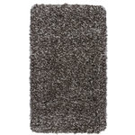 Nourison - Nourison Luxe Shag 2'2" x 3'9" Charcoal Shag Indoor Area Rug - This exceptionally plush 2-inch-deep flokati shag rug from the Nourison Luxe Shag Collection has the look and feel of luxuriously soft sheepskin, and makes a perfect addition to any casual room setting. Luxurious texture and deep grey color for a warm, soothing accent.